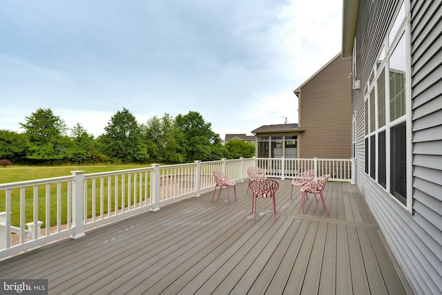 deck featuring a lawn