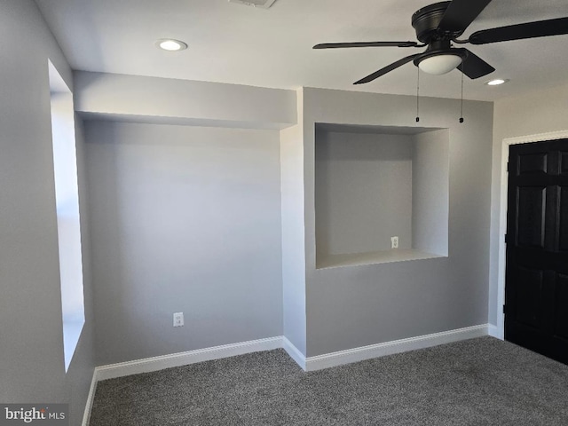 spare room with recessed lighting, baseboards, and carpet floors