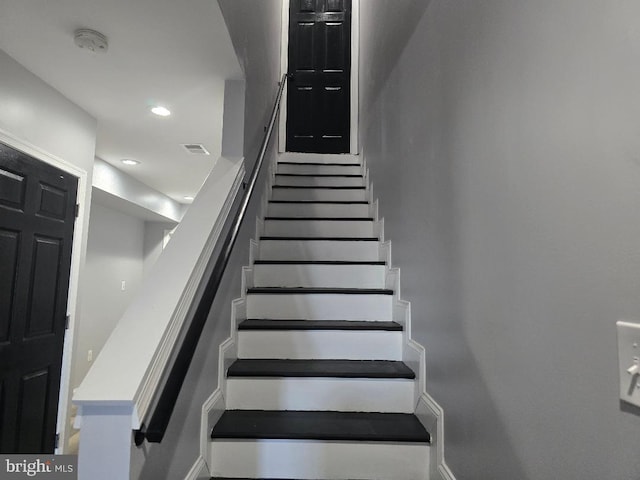 stairs featuring recessed lighting and visible vents