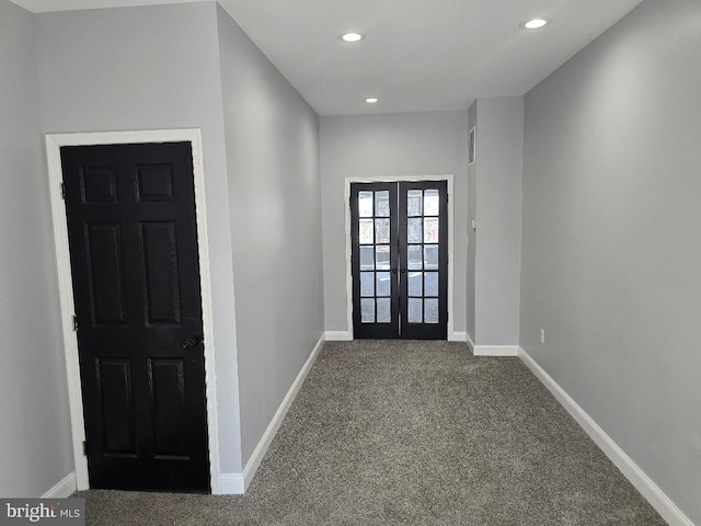 carpeted entryway featuring recessed lighting, french doors, and baseboards