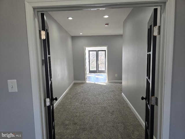 hallway featuring carpet flooring, recessed lighting, french doors, and baseboards