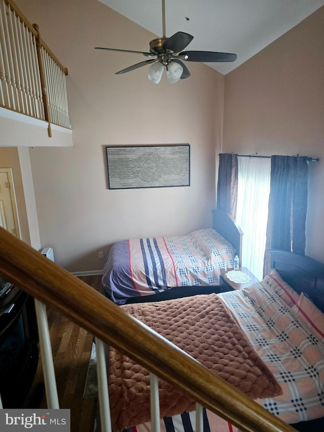 bedroom featuring ceiling fan and vaulted ceiling