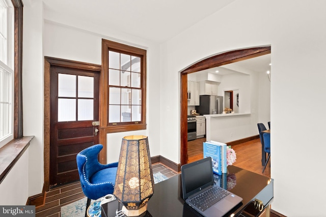 dining room with recessed lighting, wood finished floors, and baseboards