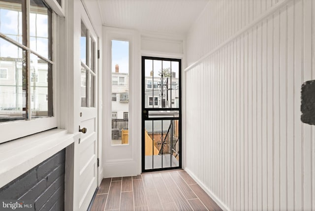 doorway with wood finish floors