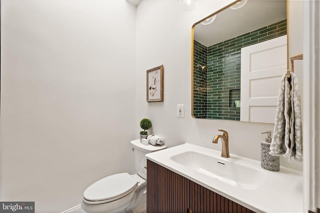 bathroom featuring toilet and vanity