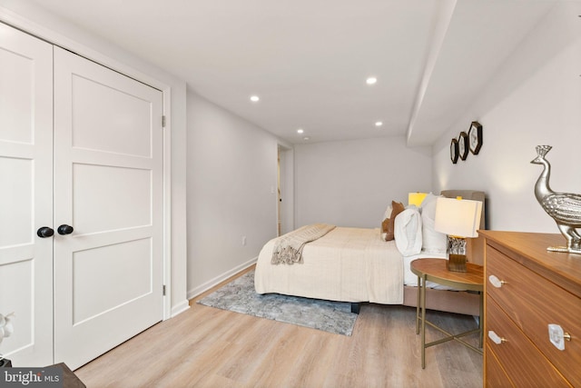 bedroom featuring recessed lighting, light wood-type flooring, and baseboards