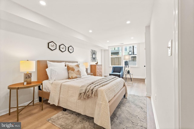 bedroom featuring recessed lighting, baseboards, and wood finished floors