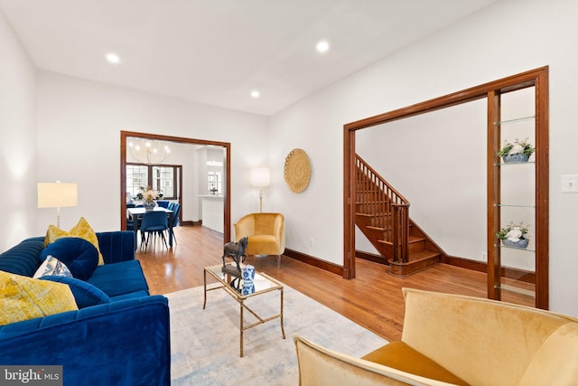 living area featuring stairway, recessed lighting, and light wood-style floors