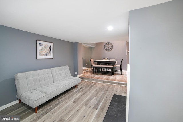 sitting room featuring baseboards and wood finished floors