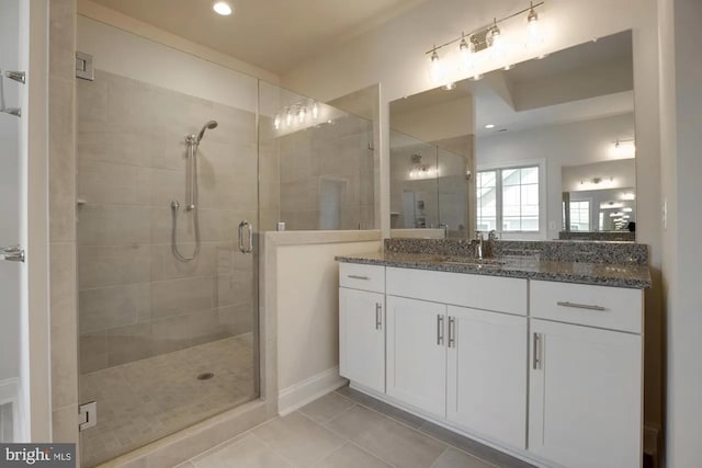 full bath featuring tile patterned floors, vanity, recessed lighting, and a shower stall