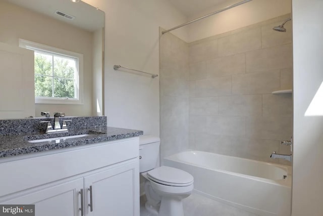 full bath featuring vanity, toilet, visible vents, and shower / washtub combination