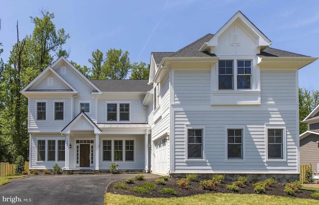 view of front of property featuring a garage and driveway