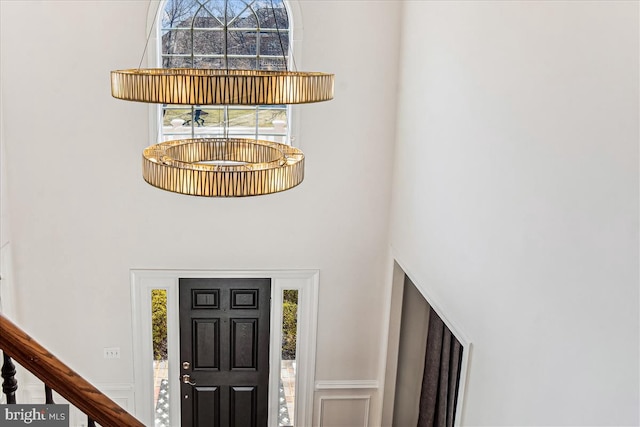 foyer featuring a towering ceiling