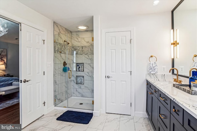 ensuite bathroom featuring a shower stall, baseboards, ensuite bathroom, marble finish floor, and vanity