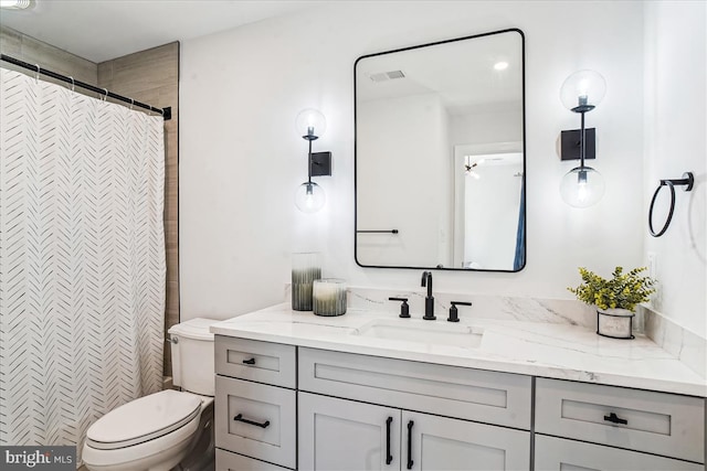 bathroom with visible vents, toilet, vanity, and a shower with shower curtain