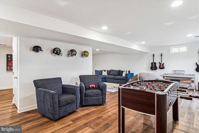 rec room featuring recessed lighting, baseboards, and wood finished floors