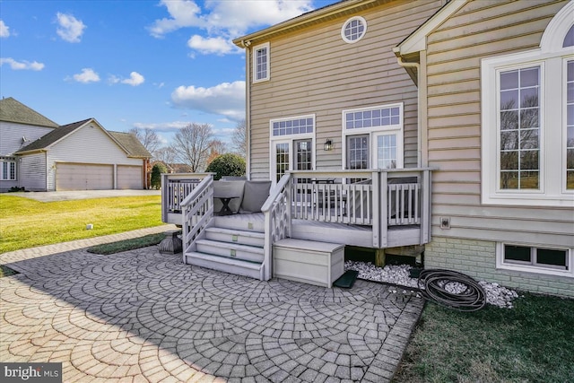 exterior space featuring a yard, an outdoor structure, and a deck