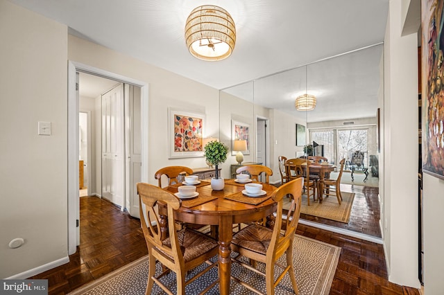 dining area featuring baseboards