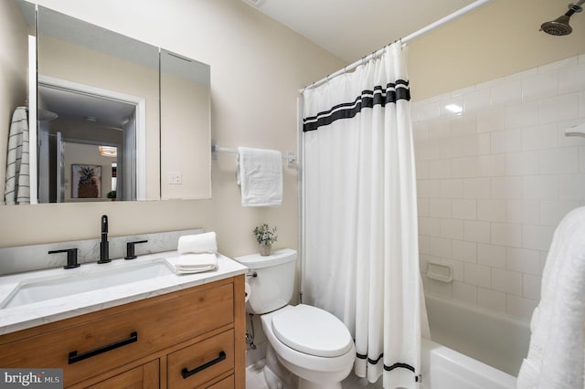 full bath featuring toilet, shower / bath combo, and vanity