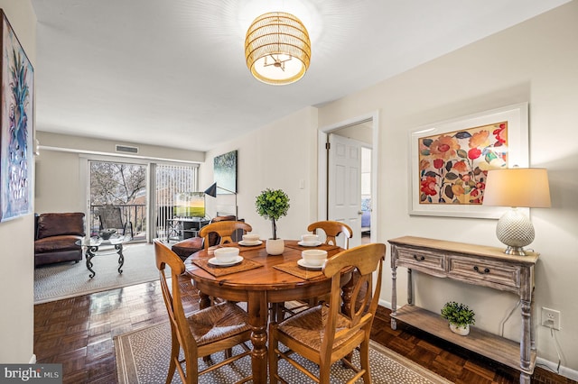 dining room with visible vents and baseboards