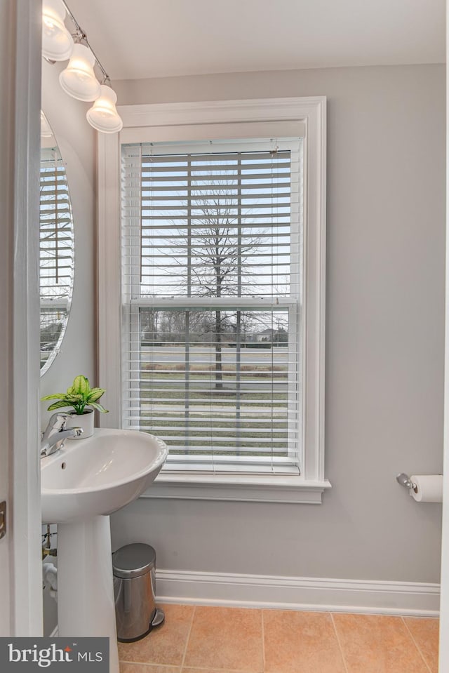 bathroom featuring tile patterned flooring and baseboards