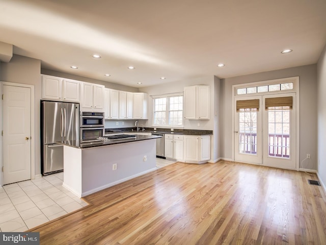 kitchen featuring visible vents, recessed lighting, appliances with stainless steel finishes, and white cabinetry