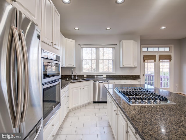 kitchen featuring a wealth of natural light, recessed lighting, appliances with stainless steel finishes, and a sink