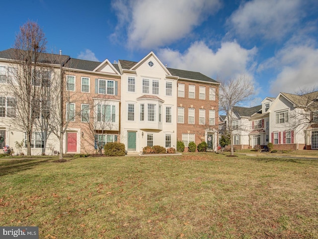 view of property with a residential view and a front yard