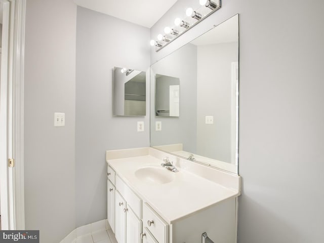 bathroom featuring baseboards and vanity