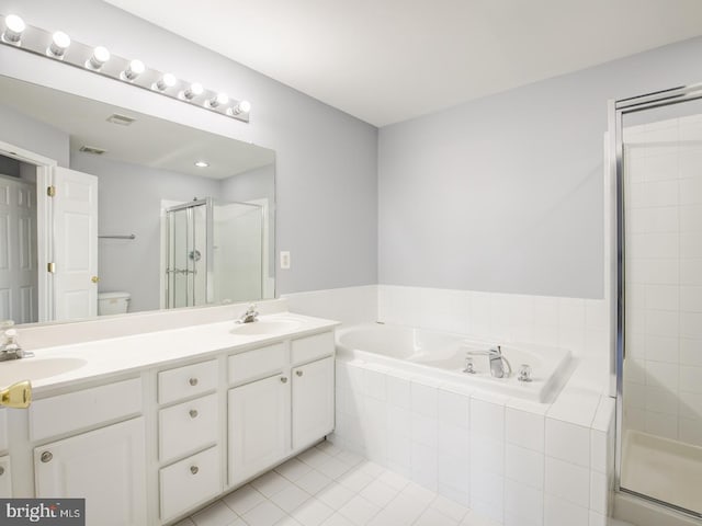 bathroom with a shower stall, a bath, double vanity, and a sink