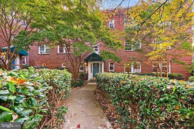 view of property with brick siding