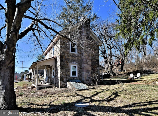 view of property exterior with stone siding