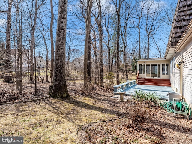 view of yard with a sunroom