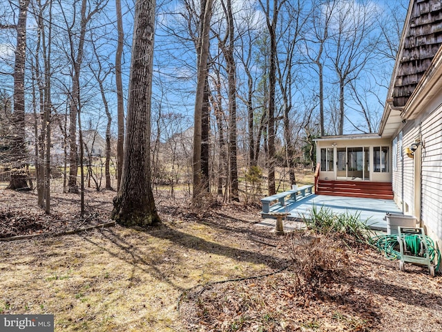 view of yard featuring a sunroom