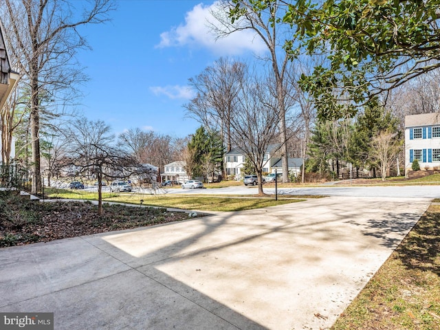 exterior space featuring a residential view and driveway