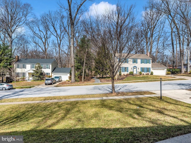 view of yard with a residential view and driveway