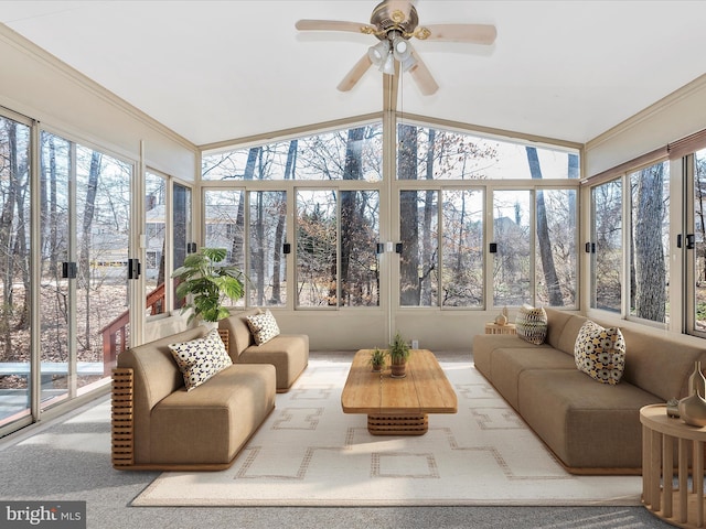 sunroom / solarium with lofted ceiling and ceiling fan