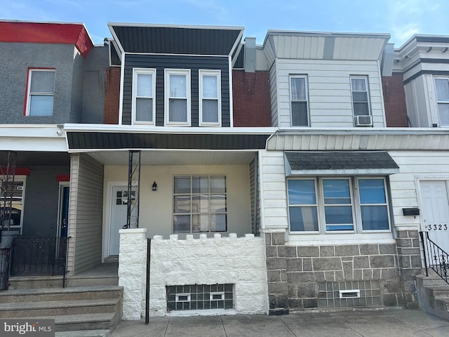 view of property featuring covered porch