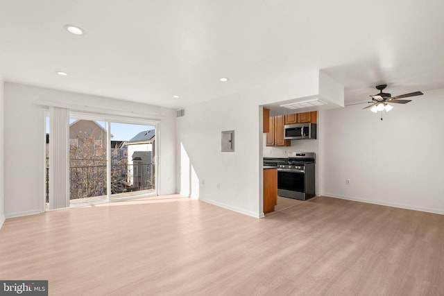 unfurnished living room with visible vents, baseboards, recessed lighting, light wood-style flooring, and a ceiling fan