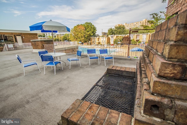 view of patio / terrace featuring fence