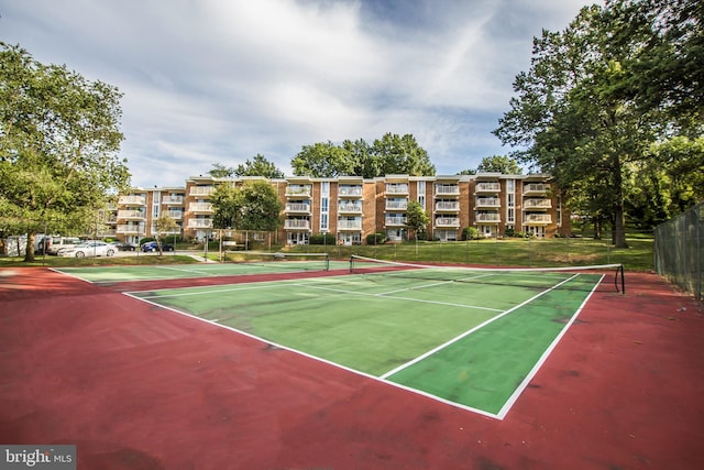 view of tennis court with fence