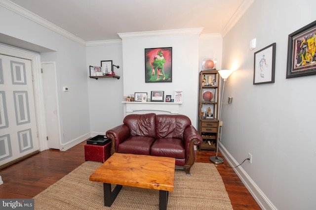 living room featuring ornamental molding, baseboards, and wood finished floors