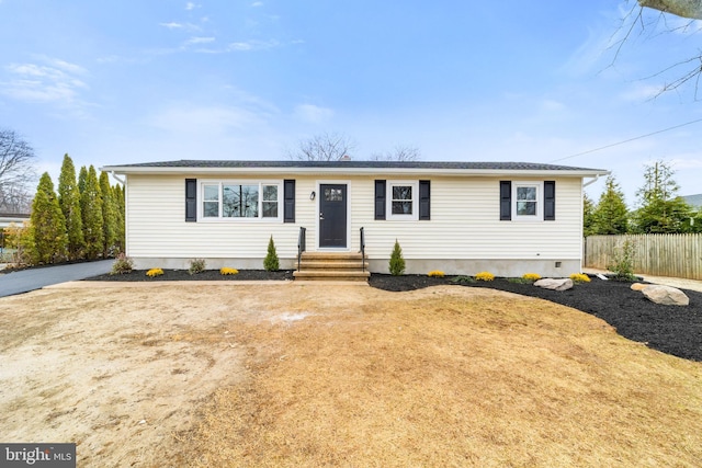 ranch-style house with fence