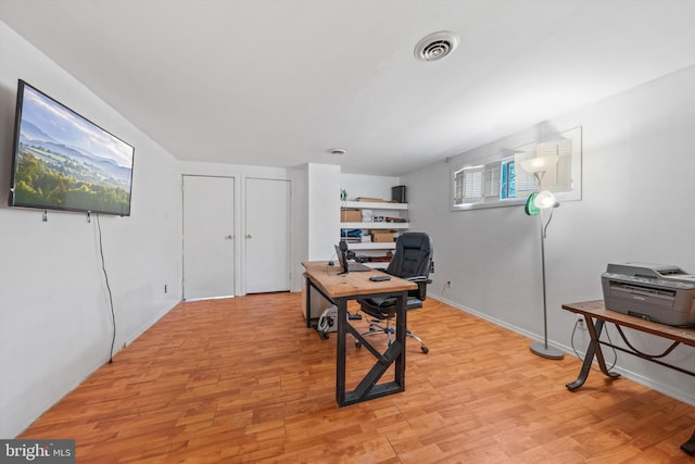 office space featuring visible vents and light wood finished floors