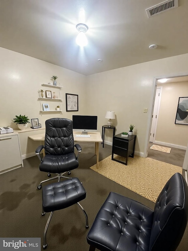 interior space with carpet, visible vents, and baseboards