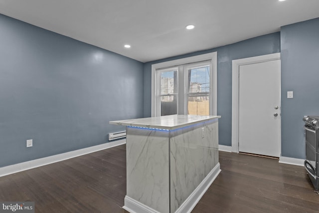 kitchen with stainless steel electric range oven, dark wood-style floors, and baseboards