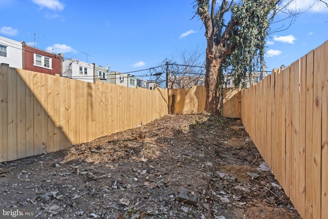 view of yard with a fenced backyard