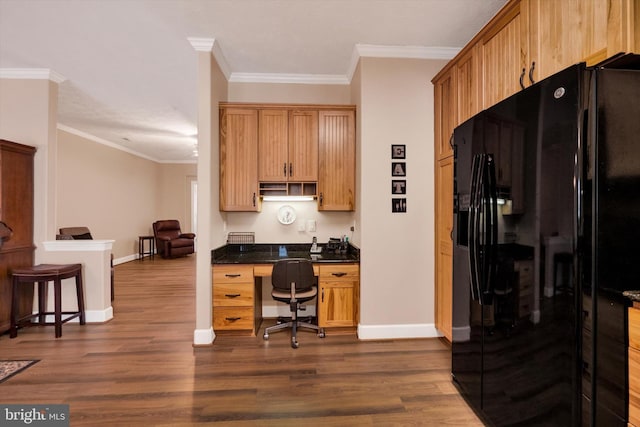 kitchen featuring ornamental molding, black fridge with ice dispenser, dark wood-style flooring, and built in study area