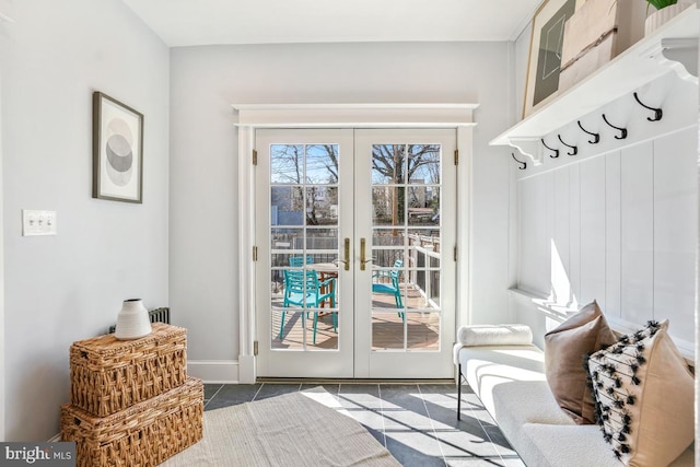 doorway with tile patterned flooring and french doors