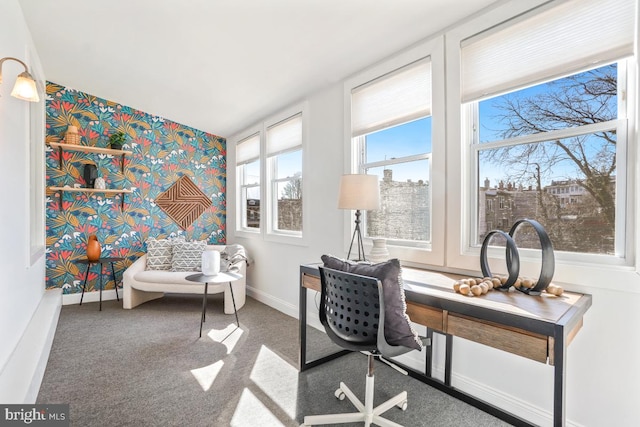 office with an accent wall, carpet, baseboards, and wallpapered walls